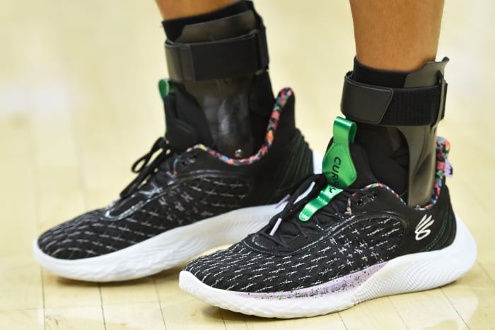 Golden State Warriors point guard Stephen Curry wearing the Sesame Street x Curry Flow 9 'Street Pack - Count It'